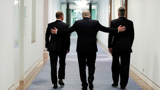 Treasurer Josh Frydenberg, Prime Minister Scott Morrison and Minister for Finance Mathias Cormann leave the press conference held after passing the government's tax cuts.