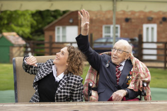 Colo<em></em>nel Tom Moore and his daughter Hannah Ingram-Moore watch a flypast over his home to celebrate his 100th birthday on April 30, 2020.