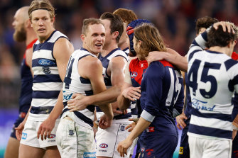 Geelong skipper Joel Selwood exchanges words with the Demons’ Ed Langdon during the 2021 first preliminary final. 