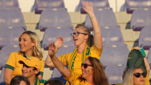 Vibe: A knot of Socceroos fans gets into the spirit in Al Ain. Some ticketed   supporters were denied entry.