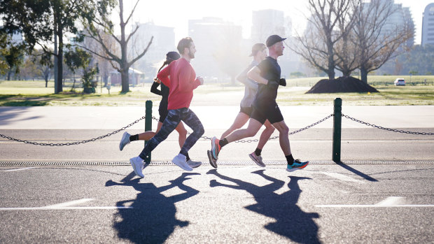 Runners at Melbourne's Albert Park Lake, which has seen a surge of foot traffic during the pandemic.