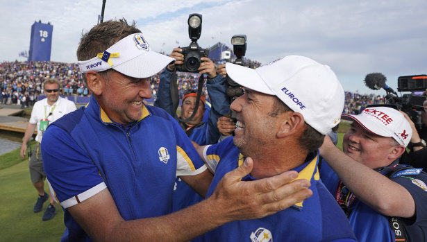 Europe's Ian Poulter and Sergio Garcia celebrate after winning the Ryder Cup at Le Golf National, near Paris, on Sunday.