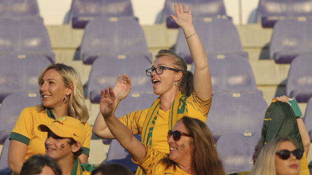 Vibe: A knot of Socceroos fans gets into the spirit in Al Ain. Some ticketed   supporters were denied entry.