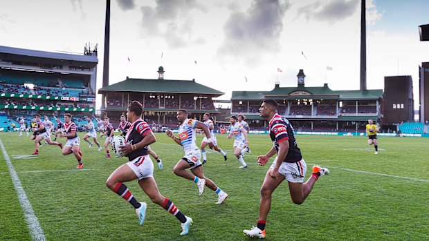 Unstoppable: Mitchell heads to the try line against the Titans at the SCG.