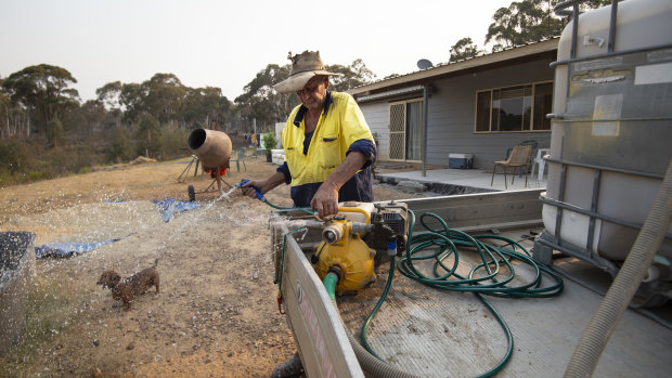 Mark Chapman checks the fire pump set up on his ute.