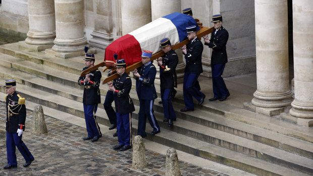 Soldiers carry the coffin of Lt. Col. Arnaud Beltram during a national ceremony.