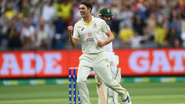 Pat Cummins celebrates dismissing captaincy counterpart Dean Elgar.