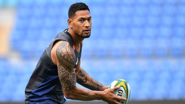 Cover up: Players like Israel Folau will be required to hide their tattoos at next year's World Cup.