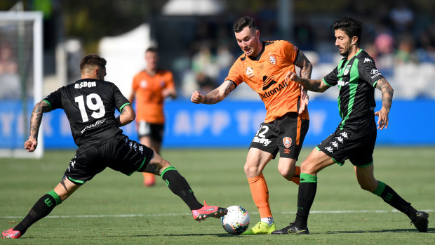 On the run: Brisbane's Aiden O'Neill attempts to sneak past Western United's Josh Risdon.