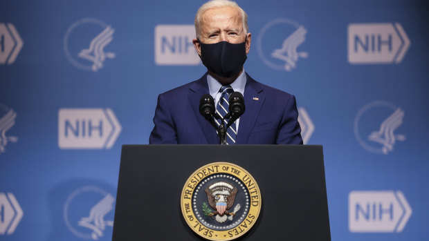 US President Joe Biden wears a protective mask while speaking at the National Institutes of Health (NIH) in Bethesda, Maryland.