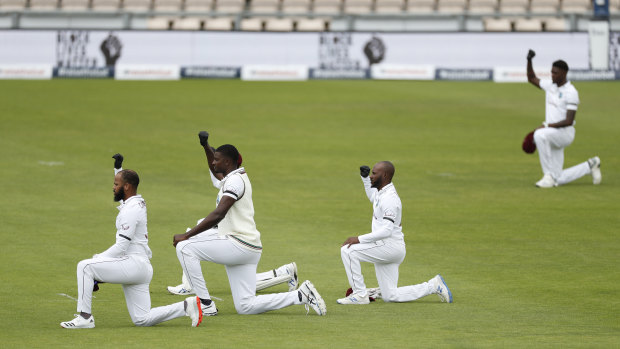 West Indies’ captain Jason Holder, centre, and teammates take a knee before the start of the Test match between England and West Indies at Southampton in 2020.