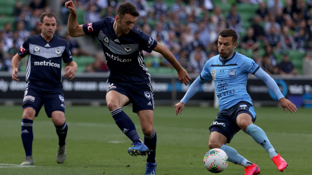 Happy returns: Kosta Barbarouses (right) added to Victory's woes with a goal on his return to AAMI Park with Sydney FC.