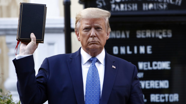 US President Donald Trump holds a Bible as he visits St John's Church, across Lafayette Park from the White House, on Monday.