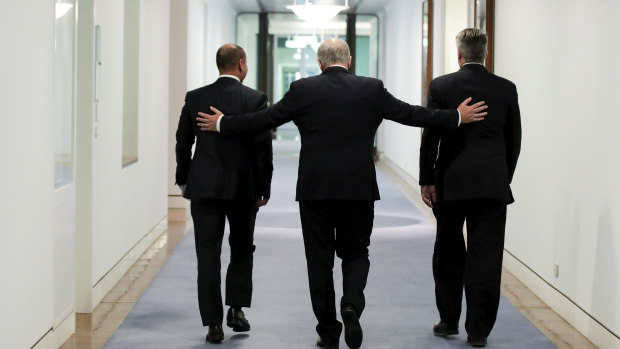 Job done: Treasurer Josh Frydenberg (left), Prime Minister Scott Morrison and Minister for Finance Mathias Cormann leave the press conference held after passing the government's tax cuts.