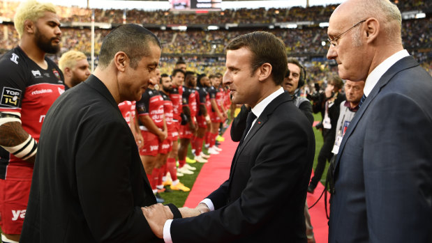 French president Emmanuel Macron (centre) shakes hands with Toulon owner Mourad Boudjellal in 2017.