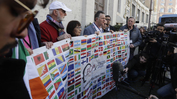 Sex abuse survivors and members of the Ending Clergy Abuse take their message to the Vatican on Wednesday. 