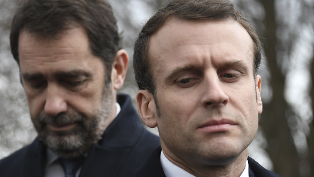 French President Emmanuel Macron and Interior Minister Christophe Castaner, left, during a visit to the vandalised Jewish cemetery.