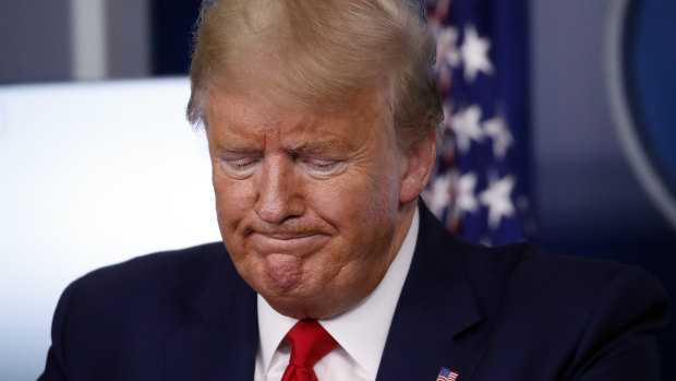 President Donald Trump pauses during a briefing about the coronavirus at the White House on Tuesday.
