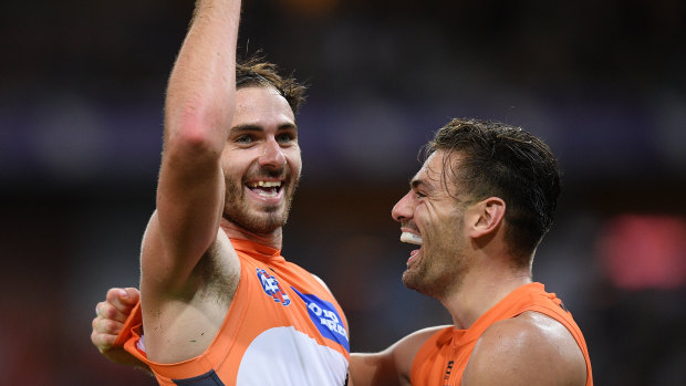 Jeremy Finlayson celebrates with Stephen Coniglio after a goal against Richmond.