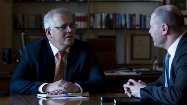 Prime Minister Scott Morrison and Treasurer Josh Frydenberg in discussion after a budget meeting in the PM’s office in August.