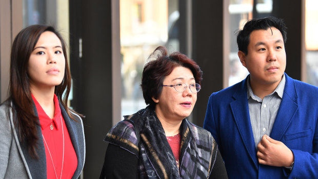 Curtis Cheng's daughter Zilvia, wife Selina and son Alpha Cheng leave the Supreme Court on Friday.