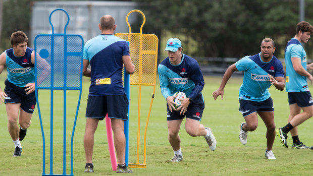 Waratahs players going about their business at training. 