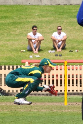 Australian fast bowler Mitchell Starc watches Alyssa Healy wicket keeping for Australia against NZ in 2012.
