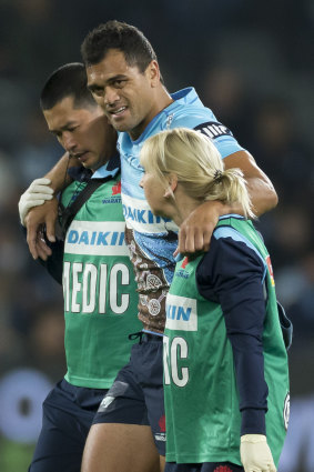 Another one bites the dust: Karmichael Hunt leaves the field with a season-ending knee injury.