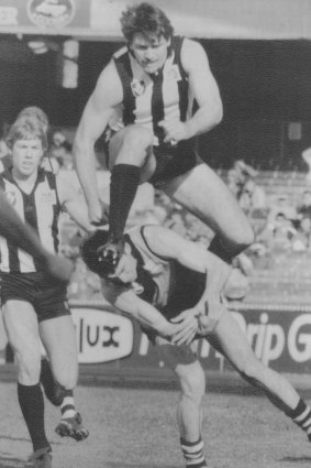 Brian Taylor as a Magpie takes on his old Tigers teammates in 1987.