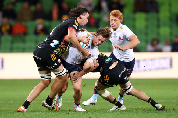 Michael Hooper is tackled by the Chiefs’ Josh Lord at AAMI Park.