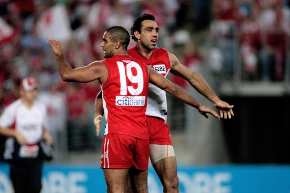 Adam Goodes and Michael O’Loughlin celebrate.