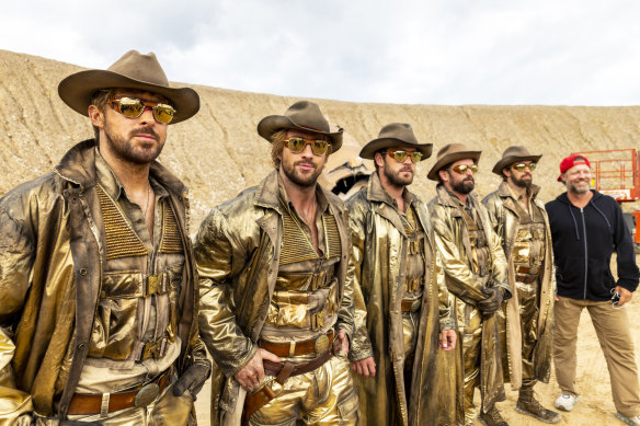 Actors Ryan Gosling (left), Aaron Taylor-Johnson with stunt doubles, Ben Jenkin, Logan Holladay, Justin Eaton, and director David Leitch.