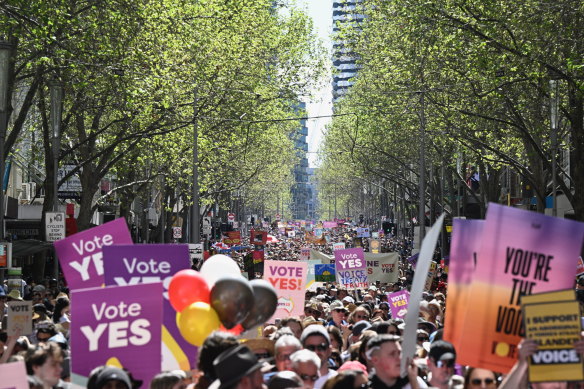 Crowds walk through Melbourne CBD for the Walk for Yes rally.