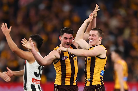 Josh Ward (right) celebrates kicking a goal with Jai Newcombe.