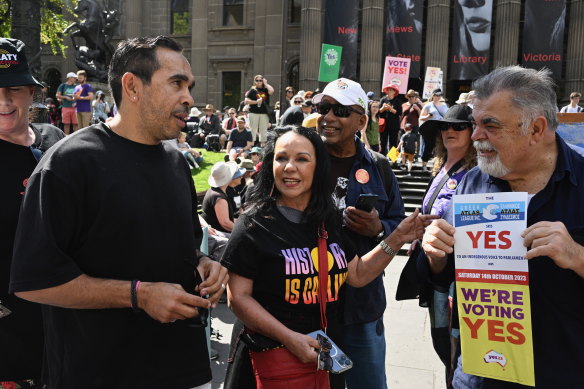 Former AFL star Eddie Betts (left) and Minister for Indigenous Australians Linda Burney at the Walk for Yes rally in Melbourne on Sunday.