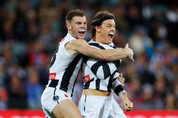 Jack Ginnivan celebrates a a goal with teammate Taylor Adams. 