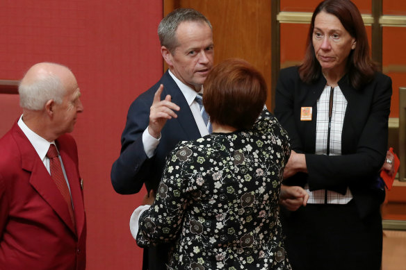 Senator Kimberley Kitching is congratulated by Opposition Leader Bill Shorten after delivering her first speech in the Senate in 2016. 