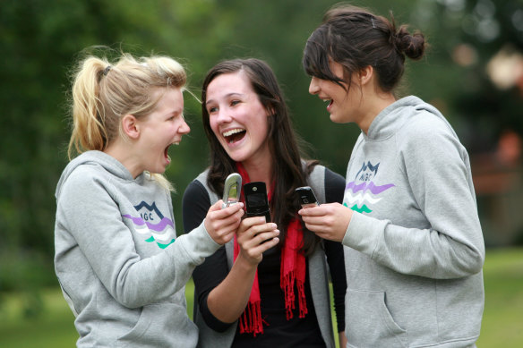 Erika Codognotto, Jessica Lowe and Jessia Khera compare their VCE results which they recieved by mobile phone in 2008.