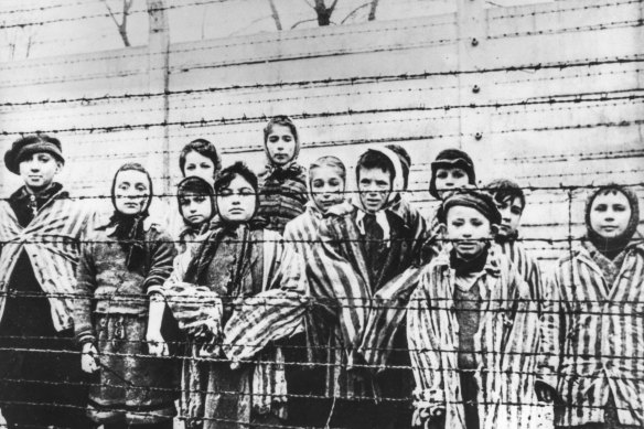 Eva Slonim, nee Weiss, third from right, front row, in white head scarf, on liberation from Auschwitz concentration camp in January 1945. Her sister Marta is looking over her shoulder, at left.