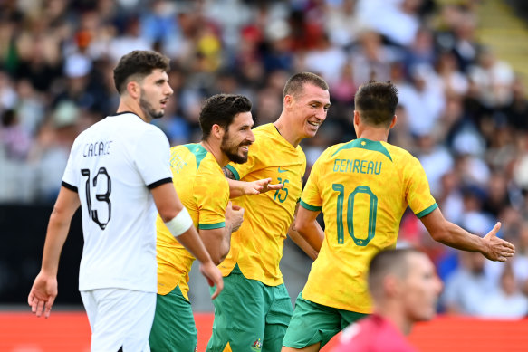 Mitchell Duke (second from right) celebrates after scoring a goal during an international friendly match against New Zealand in September.