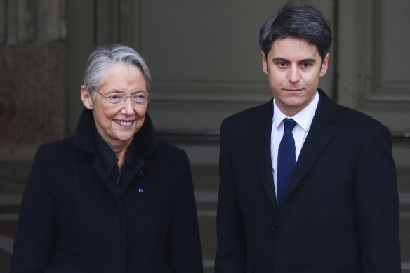 Outgoing French prime minister Elisabeth Borne welcomes newly appointed Prime Minister Gabriel Attal. 