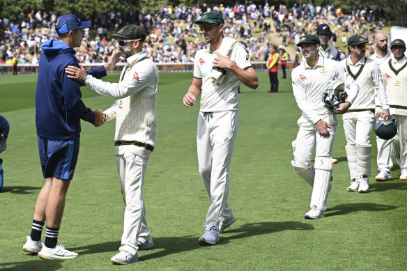 Nathan Lyon shakes hands with New Zealand captain Tim Southee after Australia’s 172-run win.