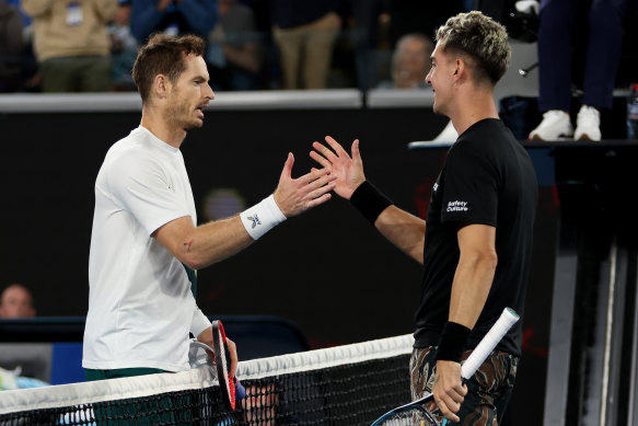 Andy Murray and Thanasi Kokkinakis embrace at the end of their five-setter after 4am local time.