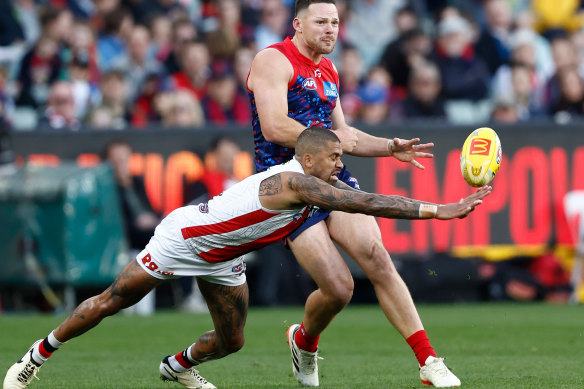 Steven May of the Dees and Bradley Hill of the Saints.