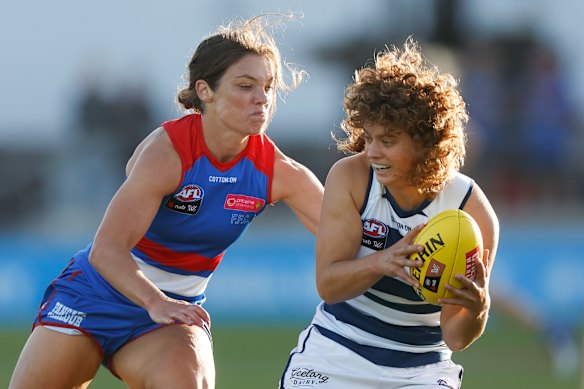 Ellie Blackburn tackles Nina Morrison of the Cats.