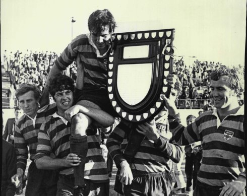 Sydney University captain Jim Roxburgh with the first grade premiership shield after victory over Easts in 1970.