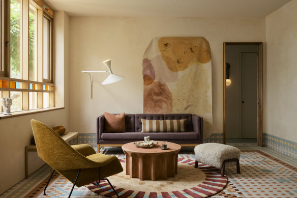 YSG Studio used tiling for the floors, extending to the walls. The many detailed frieze-like wall tiles add to the depth of each space. Bespoke graphic rugs by Nani Marquina and linen curtains designed in-house create a richness to the interiors.