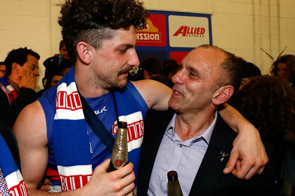 Tom and Tony Liberatore share a moment after the 2016 premiership.