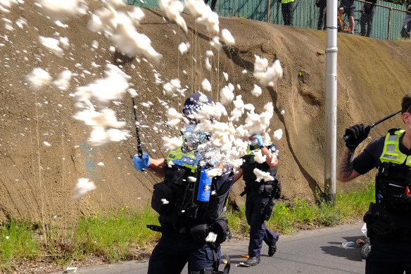 Age photographer Luis Ascui captures the moment he was doused in OC spray by police.