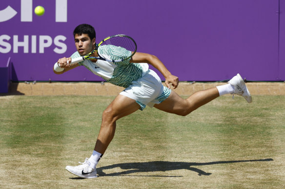 Carlos Alcaraz fires another forehand back to Alex de Minaur in the final of Queen’s.